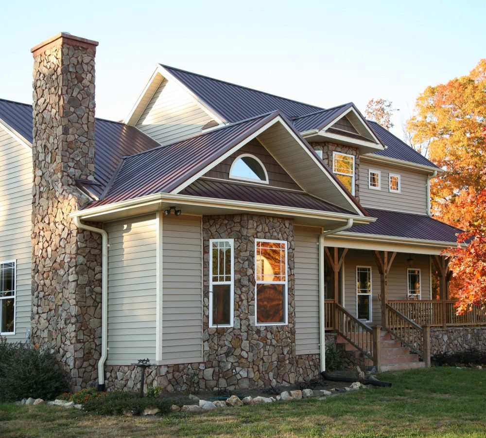 beige-and-stone-house-in-the-fall-royalty-free-image-153536402-1562166216